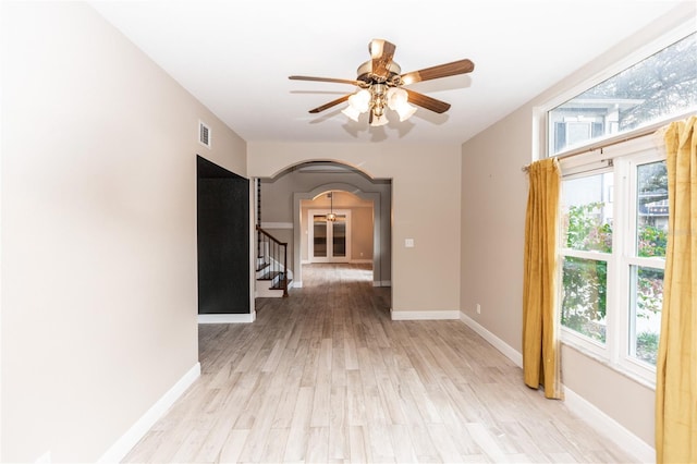 unfurnished room featuring ceiling fan and light hardwood / wood-style flooring