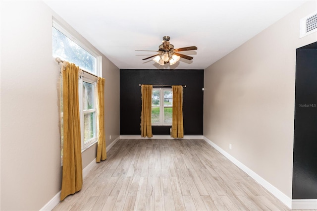 unfurnished room with ceiling fan and light hardwood / wood-style flooring