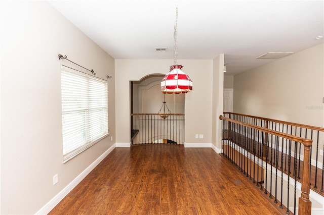 unfurnished room with hardwood / wood-style flooring