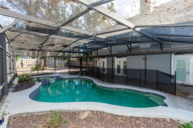 view of swimming pool with an in ground hot tub