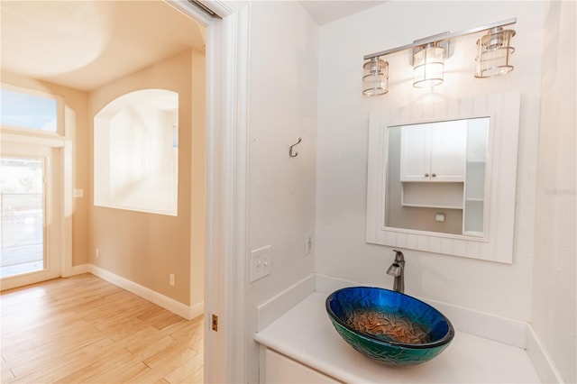 bathroom featuring hardwood / wood-style flooring and sink