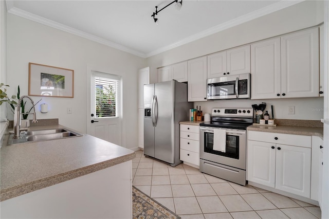 kitchen featuring white cabinetry, appliances with stainless steel finishes, sink, and ornamental molding