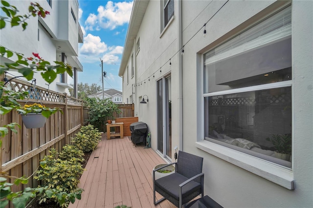 wooden deck with area for grilling