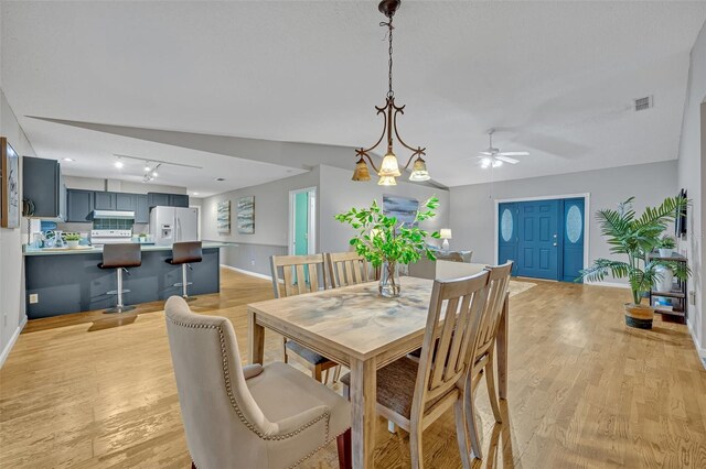 dining room featuring light hardwood / wood-style flooring and ceiling fan