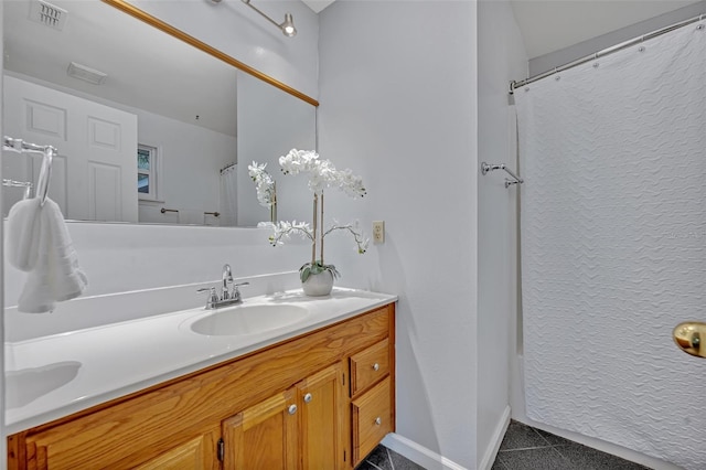 bathroom featuring vanity and a shower with curtain