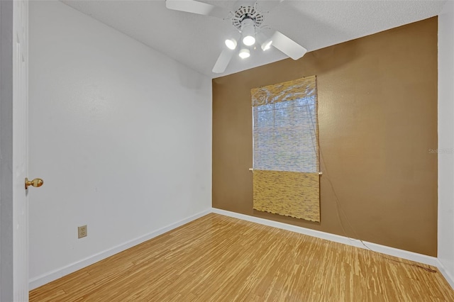 unfurnished room featuring ceiling fan and hardwood / wood-style floors