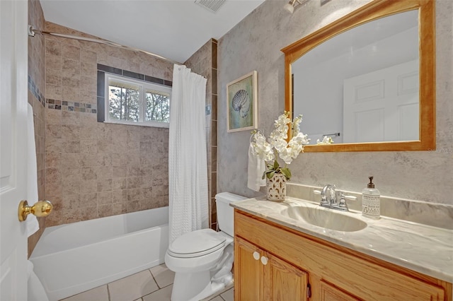 full bathroom featuring vanity, tile patterned floors, toilet, and shower / bath combo