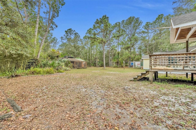 view of yard with a deck