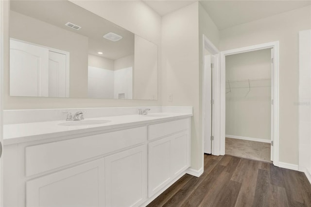 bathroom with hardwood / wood-style flooring and vanity