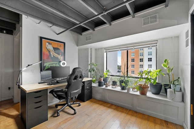 home office featuring visible vents and light wood finished floors