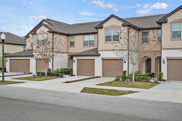 multi unit property featuring a garage