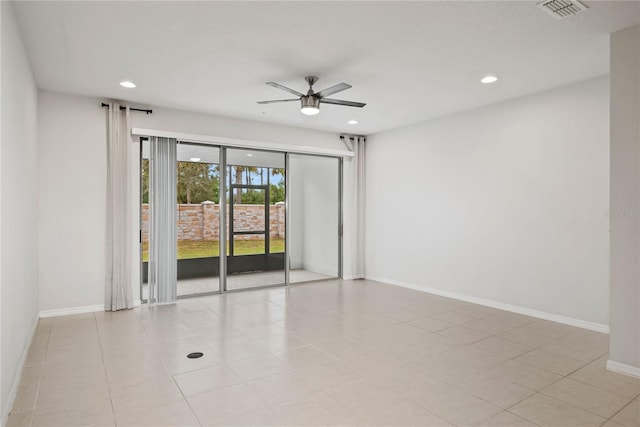 spare room with ceiling fan