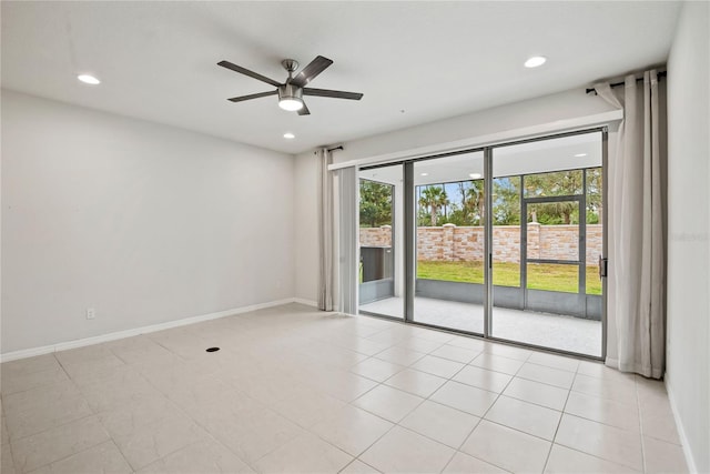 unfurnished room featuring ceiling fan and light tile patterned floors