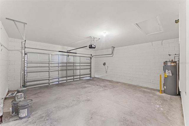 garage with a garage door opener and electric water heater