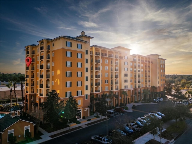 view of outdoor building at dusk