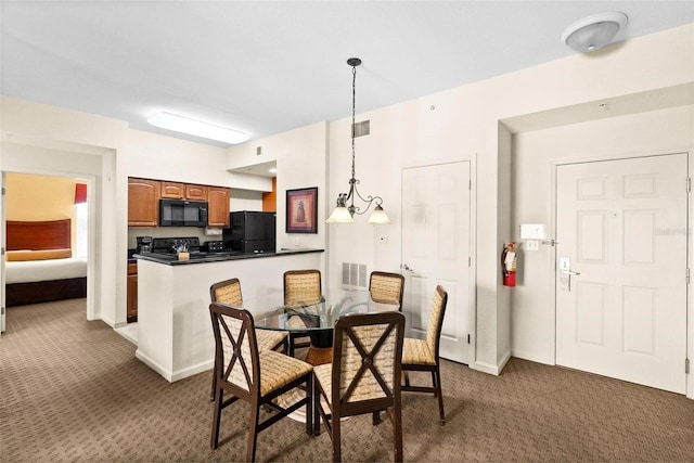 dining room with dark colored carpet