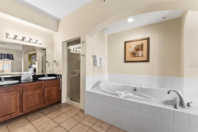 bathroom with vanity, tile patterned flooring, and separate shower and tub