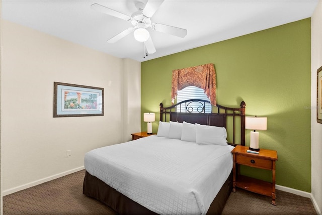 bedroom featuring ceiling fan and dark colored carpet