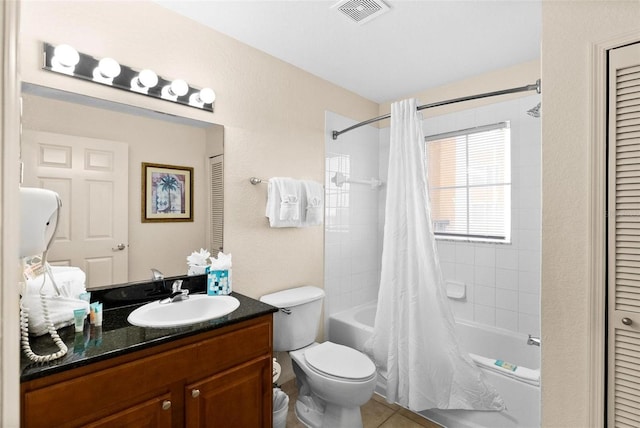 full bathroom featuring vanity, toilet, tile patterned flooring, and shower / bath combo with shower curtain