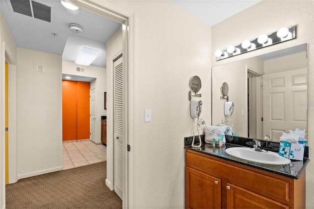 bathroom with vanity and tile patterned floors