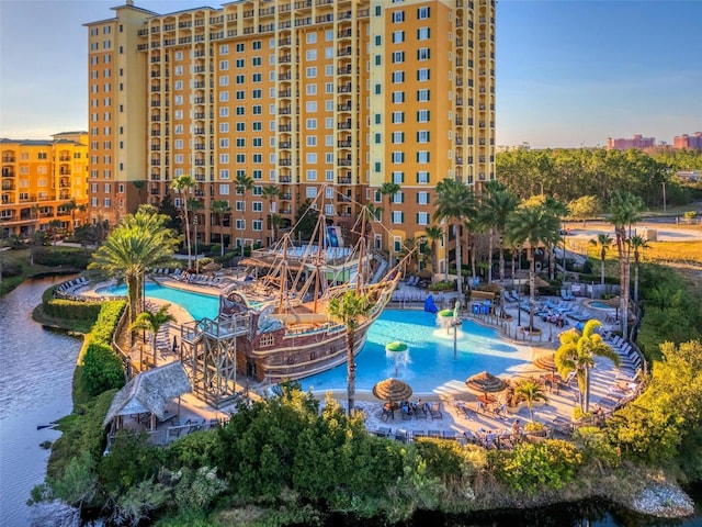 view of swimming pool with a water view