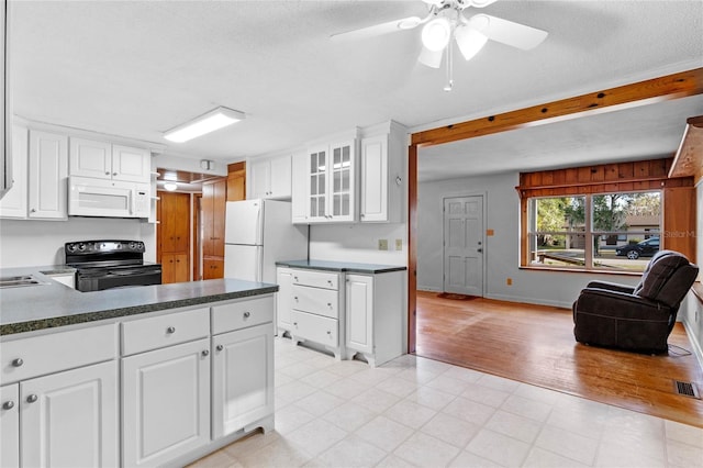 kitchen featuring white cabinetry, white appliances, ceiling fan, and a textured ceiling