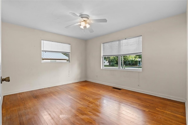 unfurnished room featuring ceiling fan and wood-type flooring