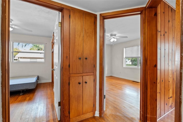 corridor with light hardwood / wood-style flooring