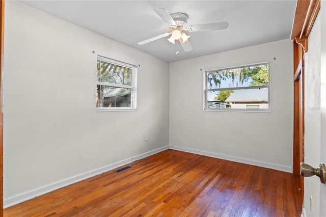 empty room featuring ceiling fan and wood-type flooring