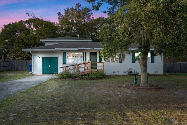 view of front of property with a lawn