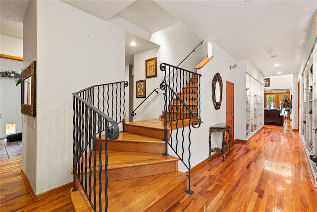 staircase featuring wood-type flooring