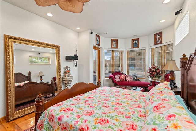 bedroom featuring wood-type flooring and ceiling fan