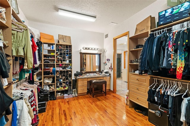 spacious closet featuring light wood-type flooring