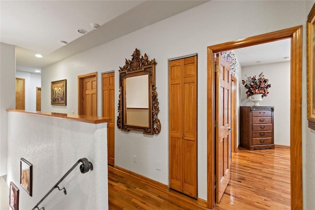 hall with light hardwood / wood-style floors