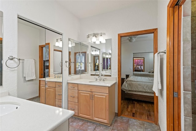 bathroom featuring vanity, tile patterned floors, and ceiling fan