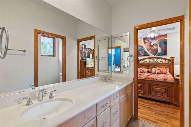 bathroom with vanity and hardwood / wood-style floors