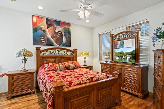 bedroom featuring ceiling fan and hardwood / wood-style floors