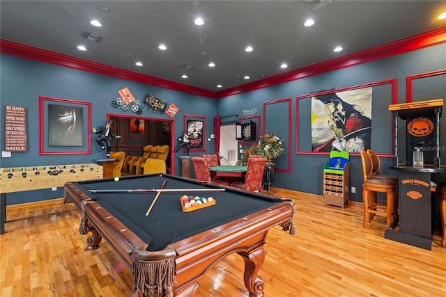 recreation room with billiards, hardwood / wood-style flooring, and ornamental molding