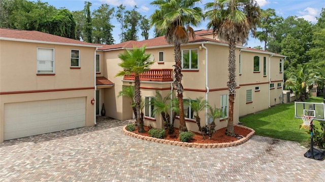 mediterranean / spanish house featuring a garage