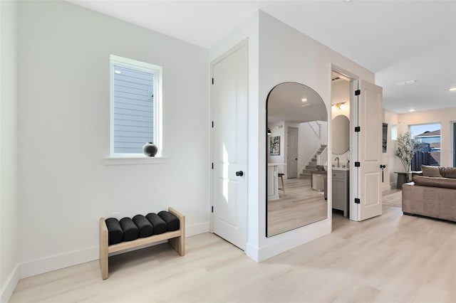 hallway with light wood-type flooring