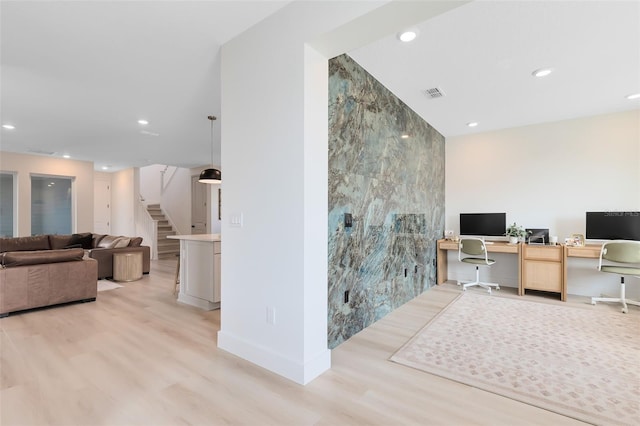 office area featuring tile walls and light hardwood / wood-style floors