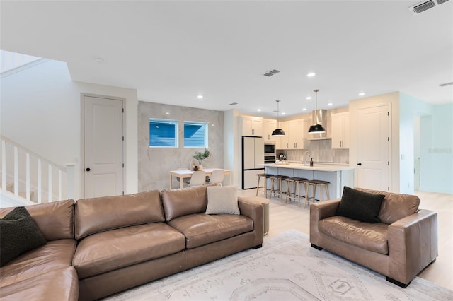 living room with light hardwood / wood-style floors