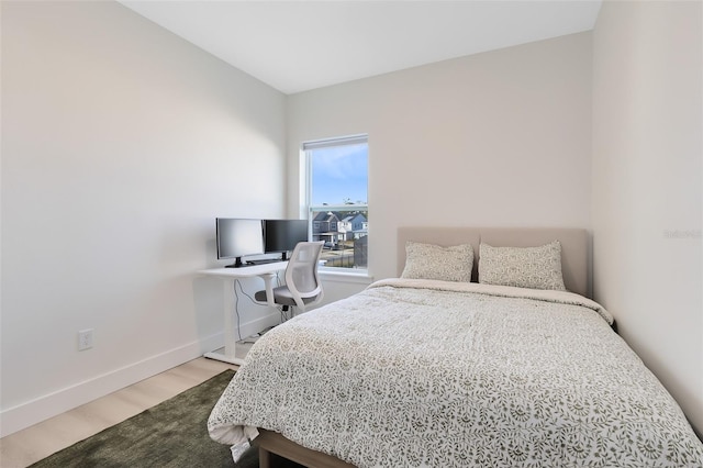 bedroom with wood-type flooring