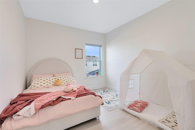 bedroom featuring light wood-type flooring