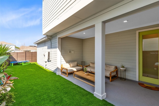 exterior space with an outdoor living space and a trampoline