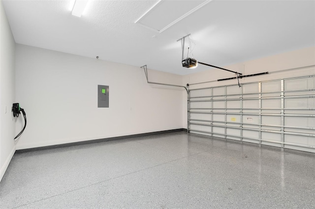 garage with a garage door opener and electric panel