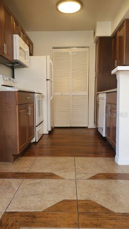 kitchen with dark hardwood / wood-style flooring