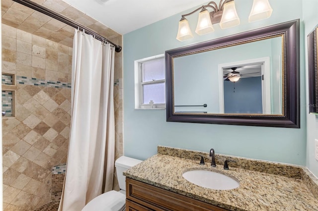 bathroom with vanity, curtained shower, and toilet