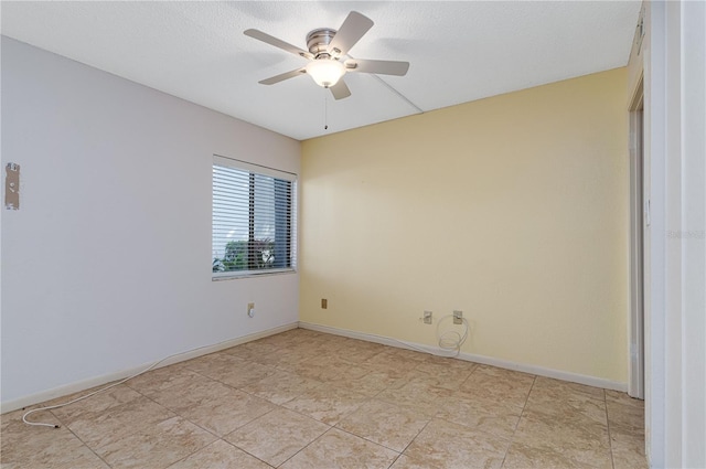 spare room featuring ceiling fan and a textured ceiling