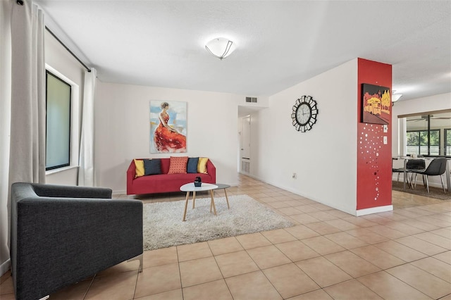 living room with light tile patterned flooring